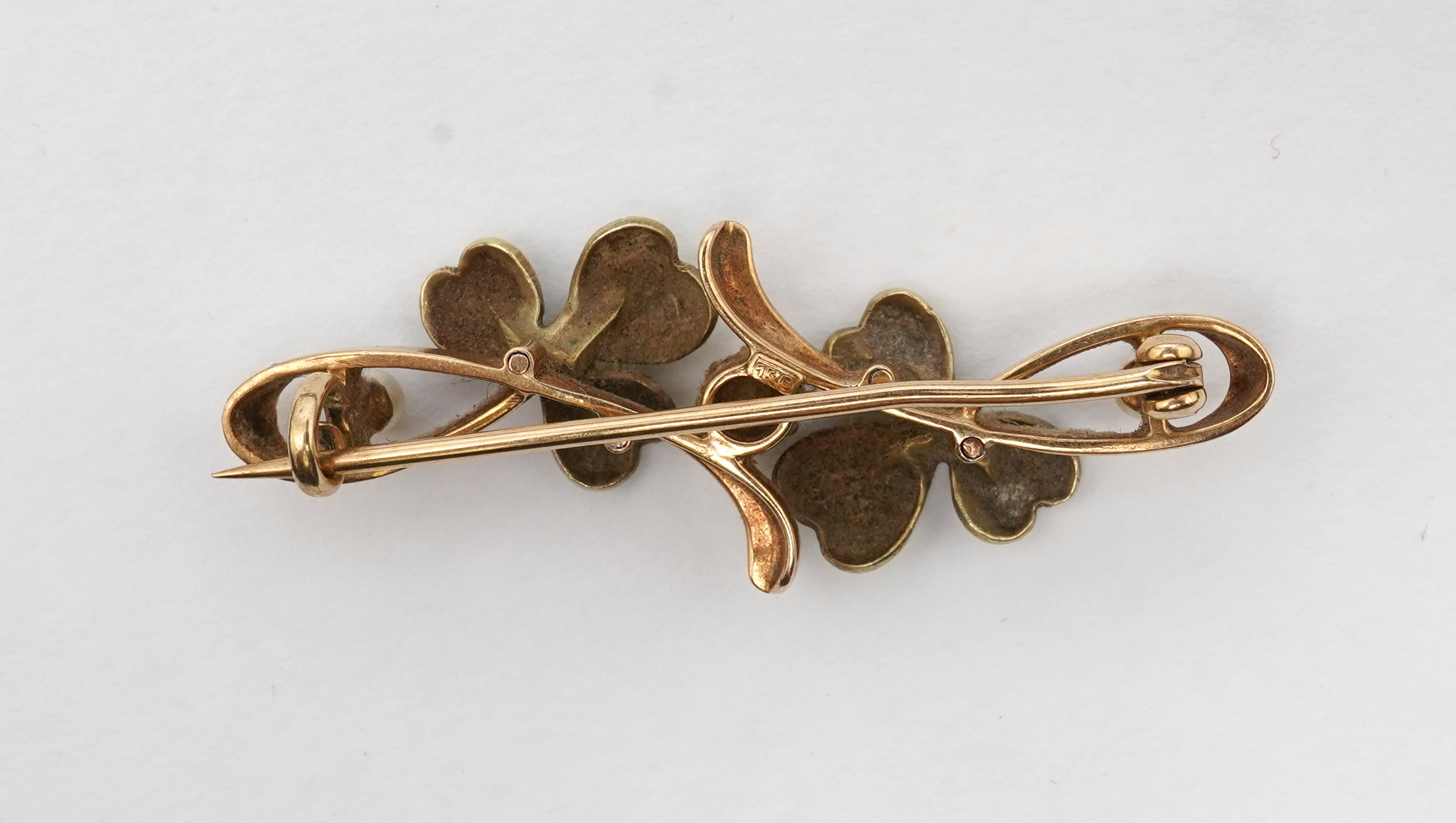 An Art Nouveau gold, enamel, seed pearl and diamond bar brooch, early 20th century